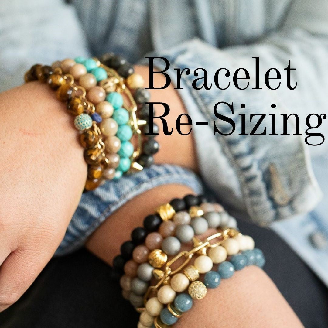 A woman wearing a jean jacket and denim pants with beaded bracelets by Meghan Bo Designs.